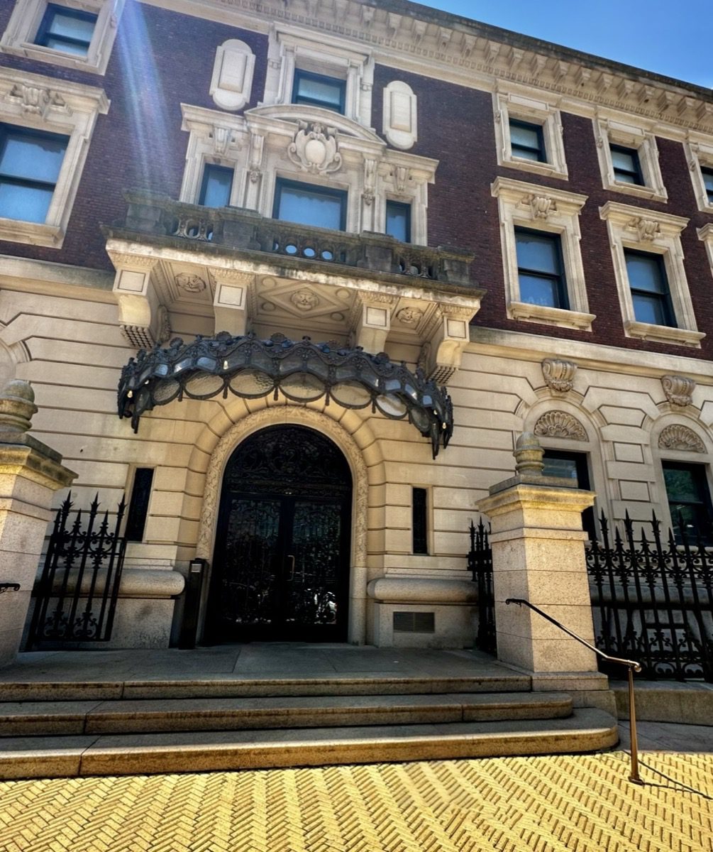 Carnegie Mansion exterior — arched entrance, stone facade, 91st Street and Fifth Avenue