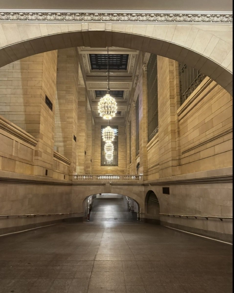 Grand Central Terminal interior corridor — arched passage, chandeliers, empty hallway