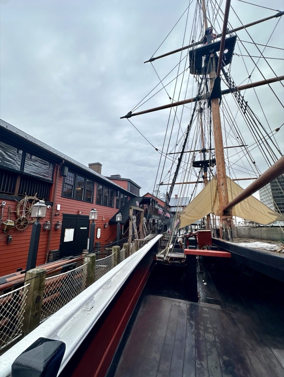 Wet deck of the replica tall ship at Boston Tea Party Museum with masts and rigging above