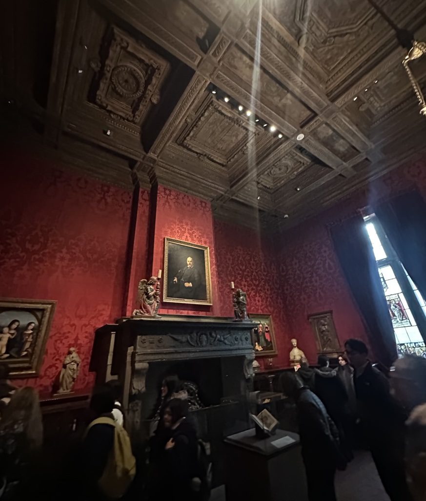 Morgan's study — red damask walls and portrait